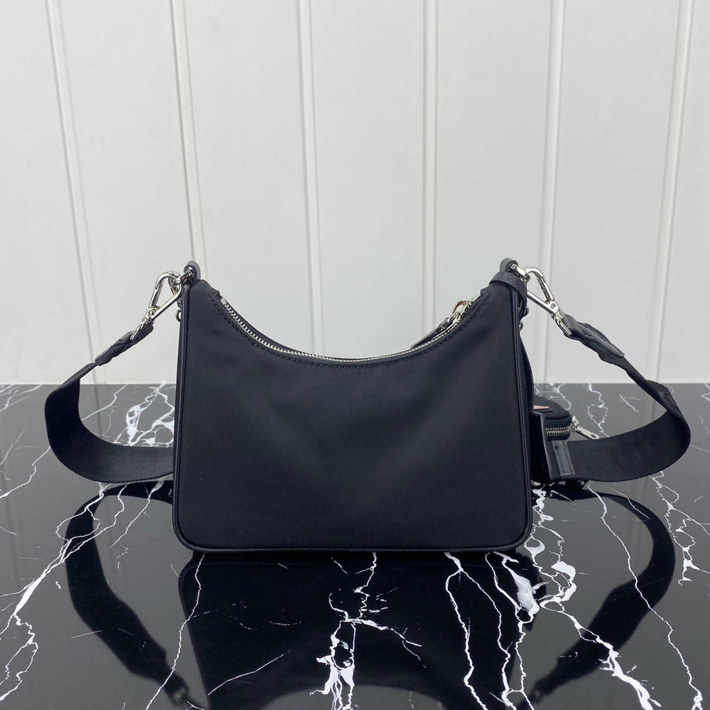 PRADA HOBO 22 BAG IN BLACK RE-NYLON WITH RED LOGO