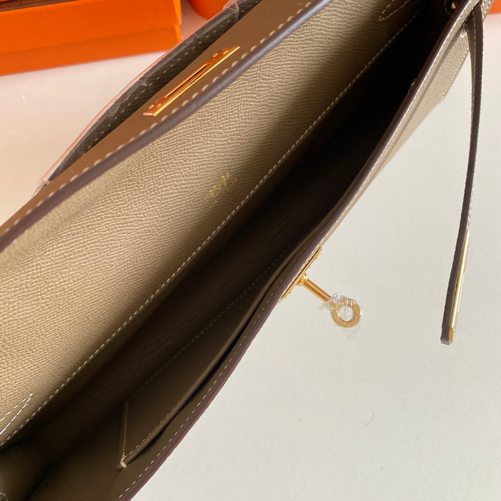 HERMES KELLY CUT 31 IN MOCHA BROWN CALFSKIN WITH GOLD HARDWARE