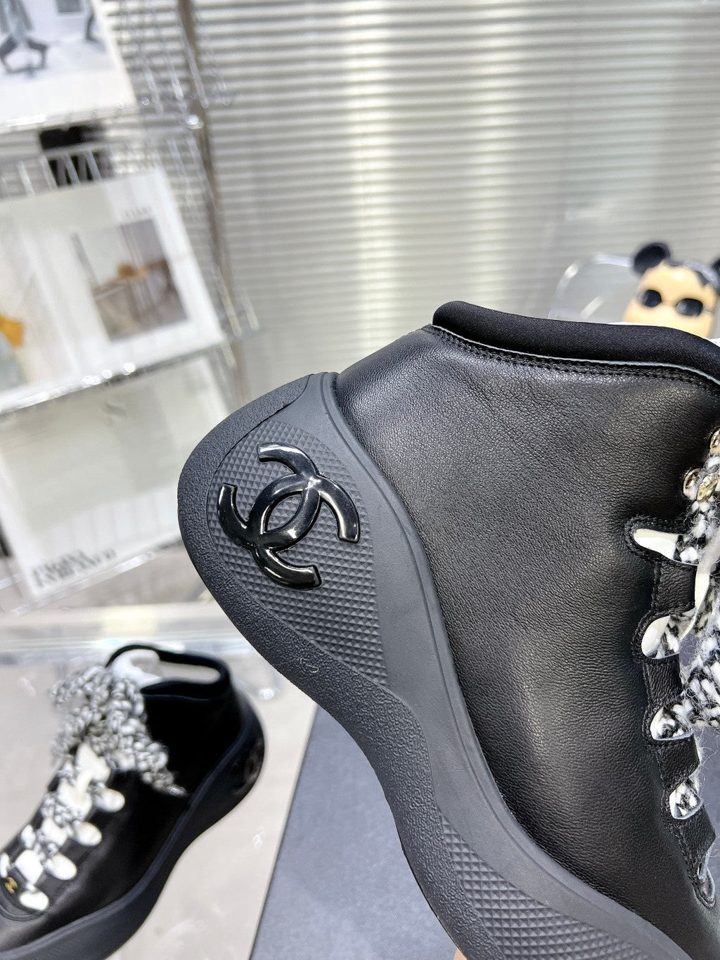 CHANEL CANO ALTO SNEAKER IN BLACK CALFSKIN AND RUBBER