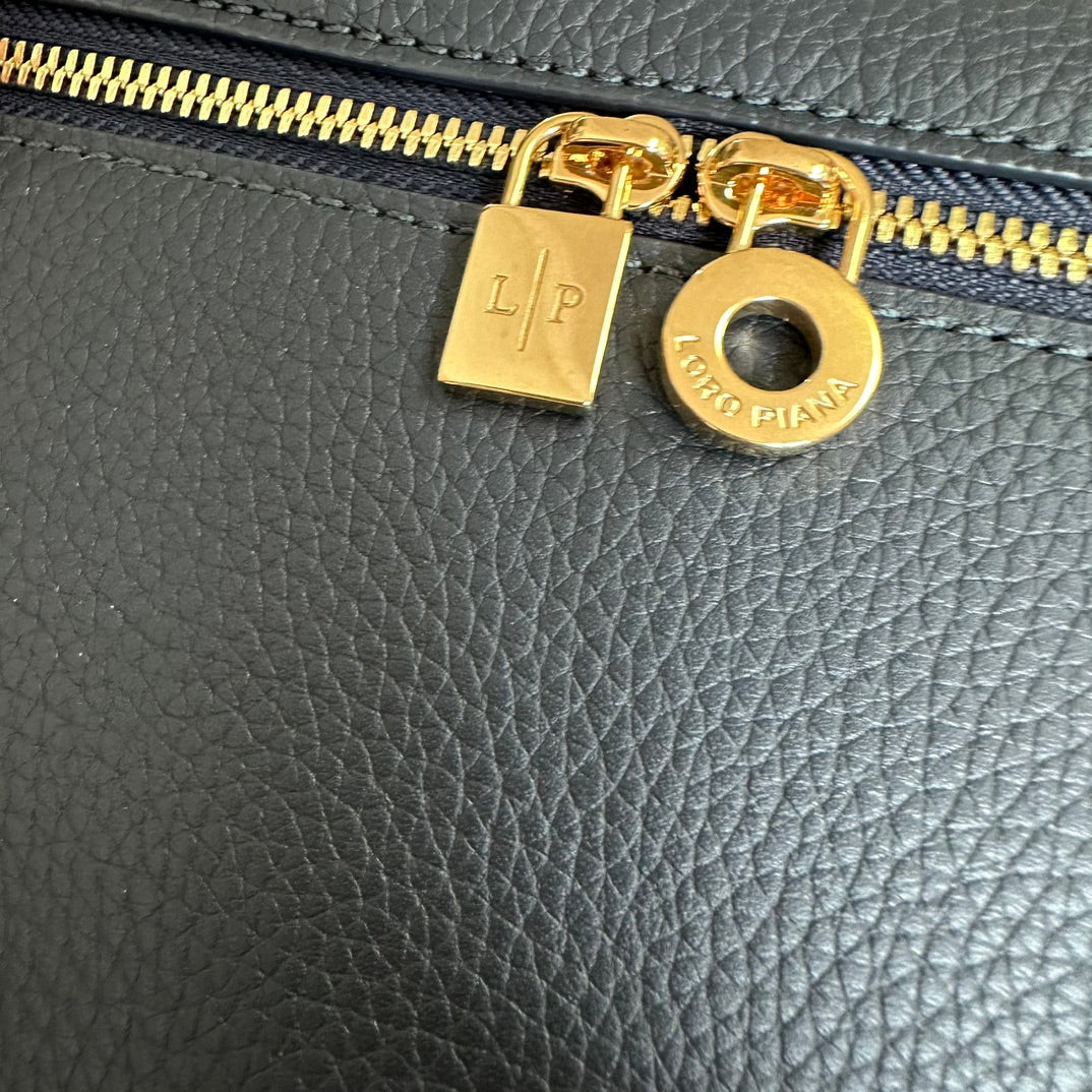 EXTRA POCKET BACKPACK L23.5 IN DARK BLUE CALFSKIN WITH GOLD HARDWARE