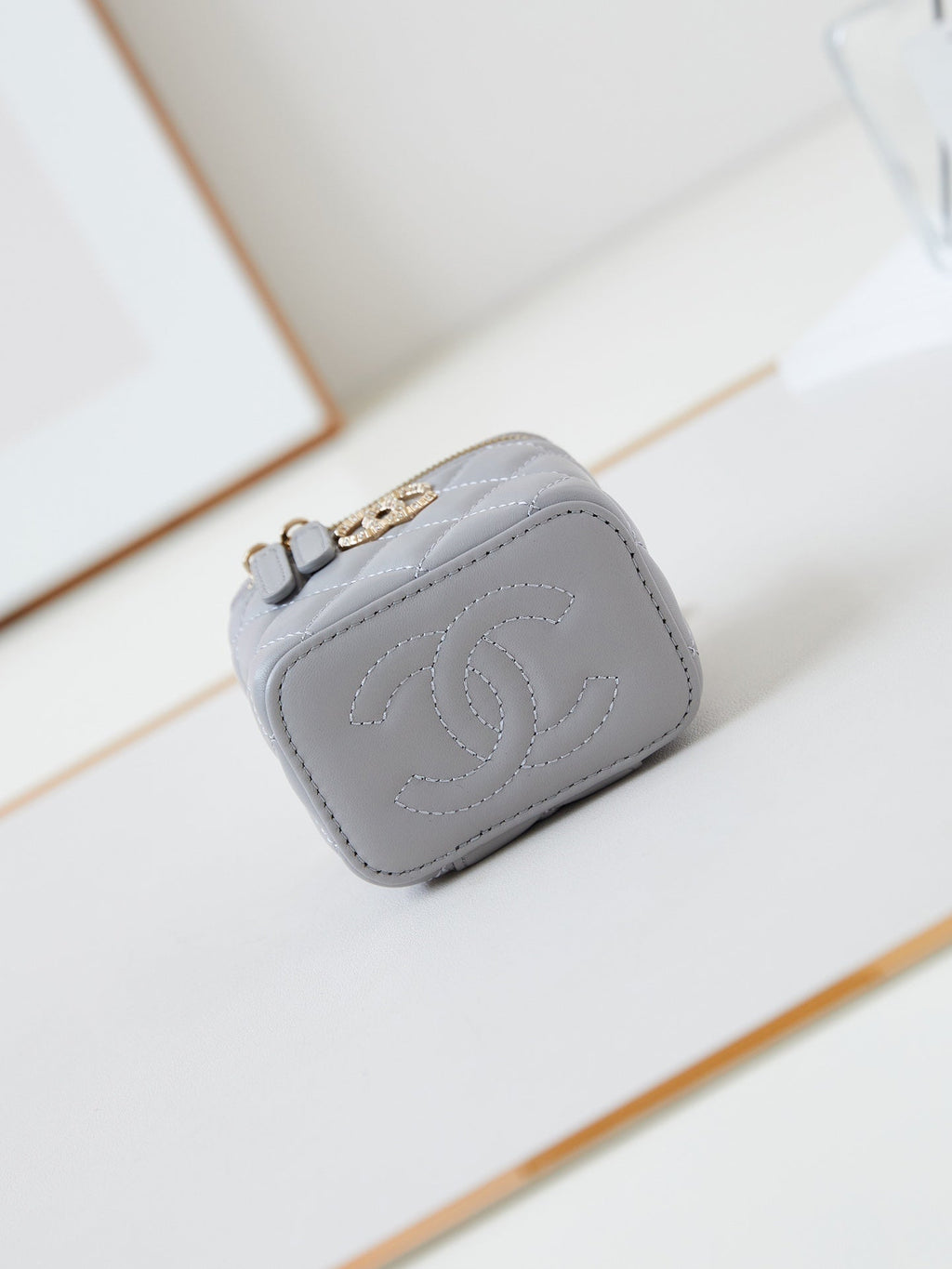 CHANEL 25S MINI VANITY BAG 11 CM IN GREY LAMBSKIN WITH CRYSTAL-EMBELLISHED  LOGO