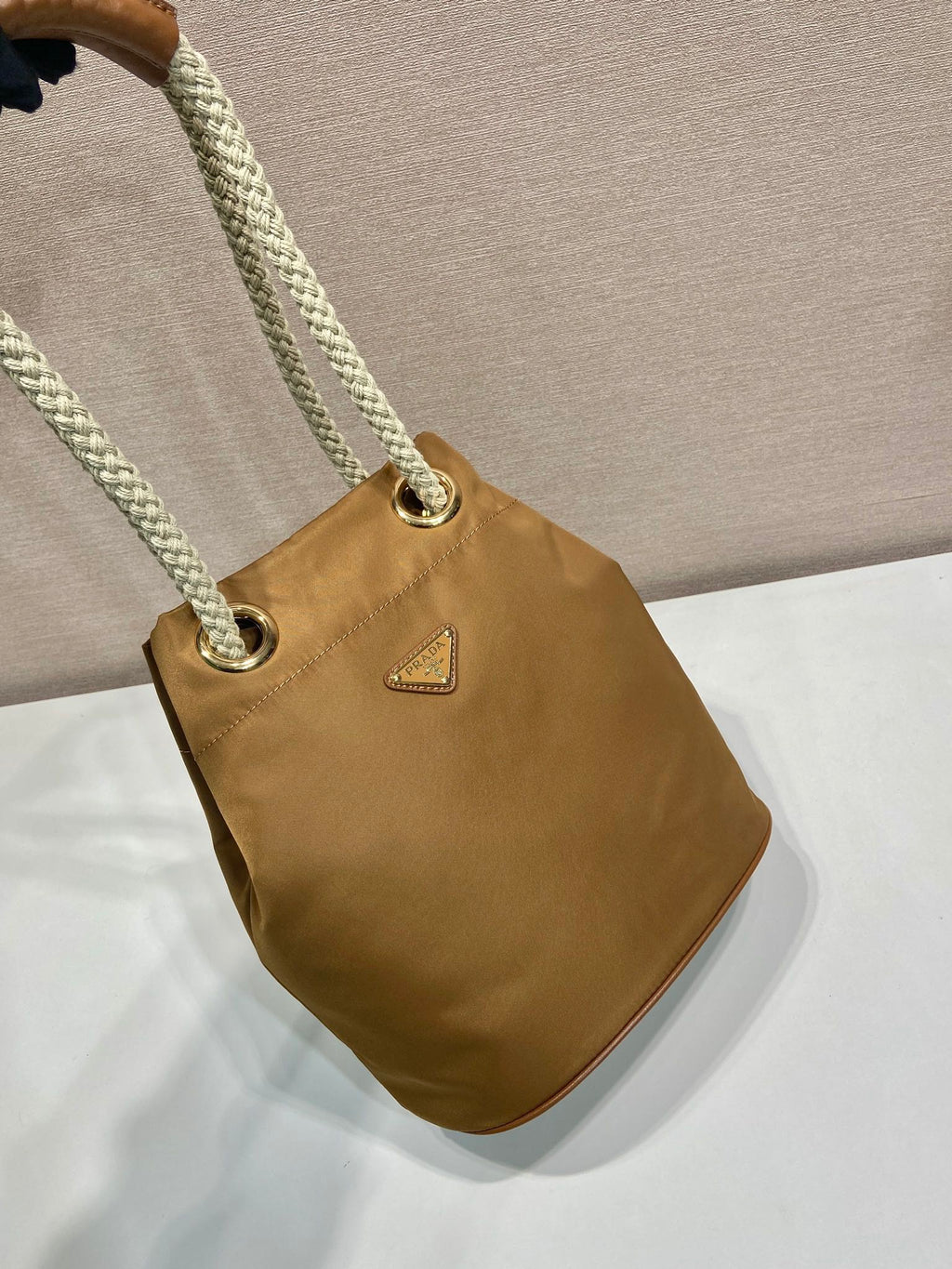 PRADA BUCKET BAG 28 IN SEPIA BROWN RE-NYLON GOLD LOGO