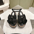 CHANEL SLIPPERS WITH SILK BOW IN BLACK COWHIDE