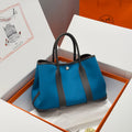 HERMES GARDEN PARTY 30CM IN BLUE TOILETS COTTON CANVAS AND BLACK CALFSKIN