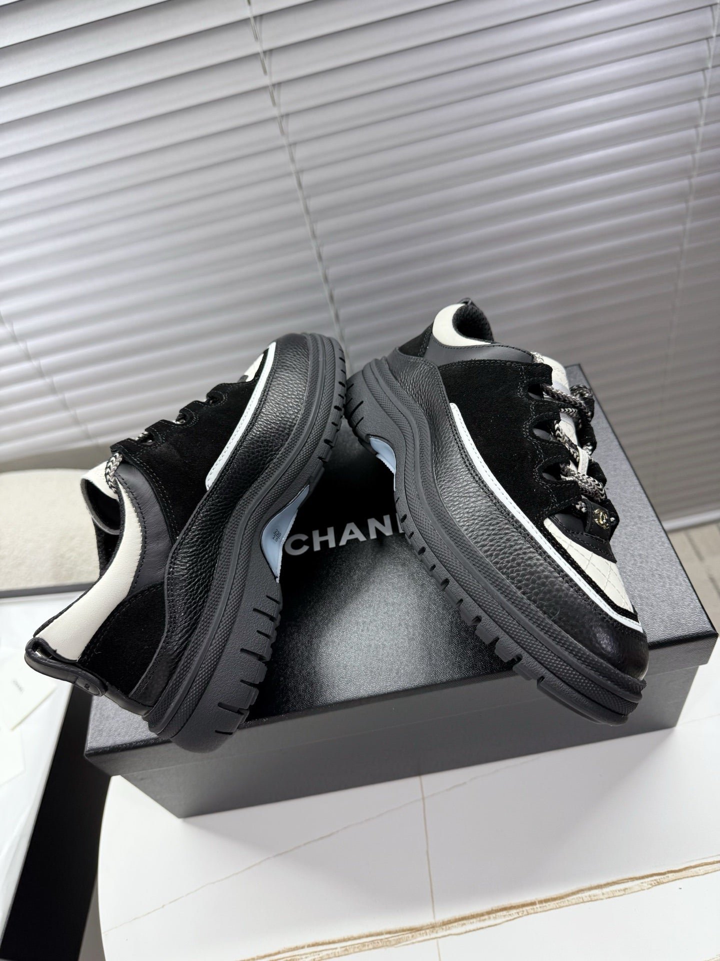 CHANEL 25S SNEAKERS 35MM IN BLACK AND WHITE CALFSKIN
