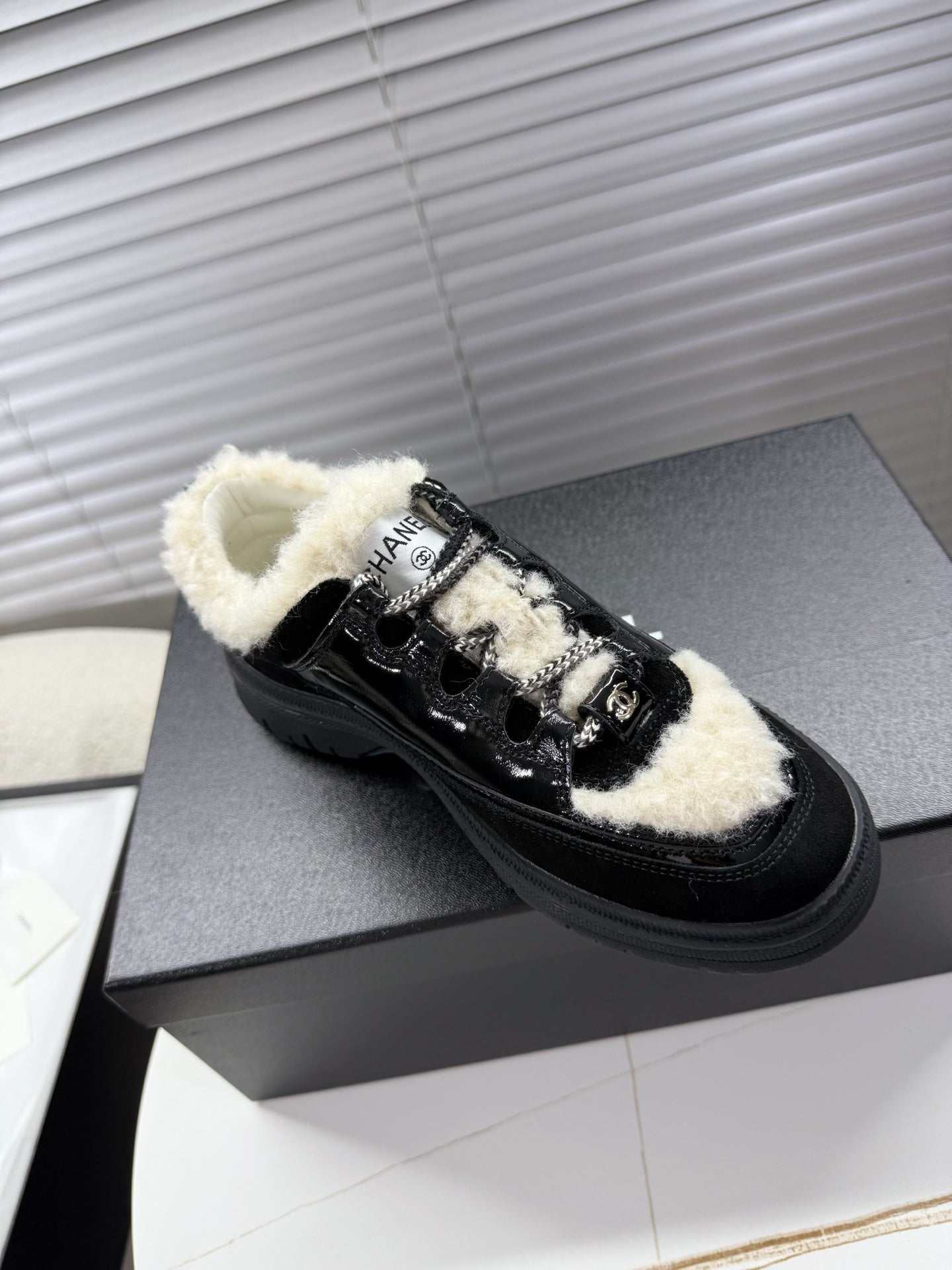 CHANEL 25S SNEAKERS WITH FUR AENTS 35MM IN BLACK CALFSKIN
