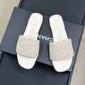 CHANEL WOVEN SLIPPERS WHITE COWHIDE SOLE