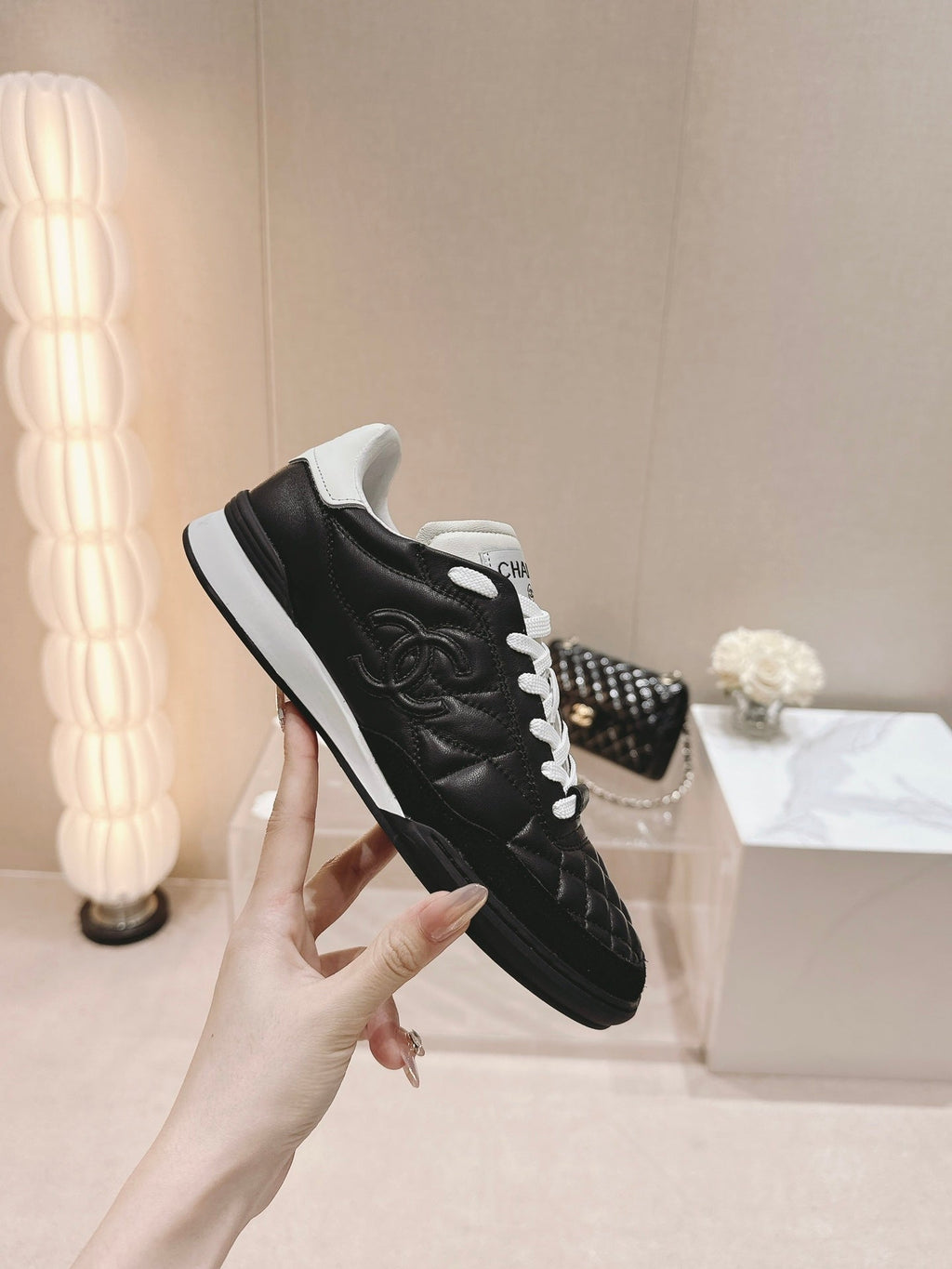 CHANEL SNEAKERS IN GLOSSY BLACK LAMBSKIN