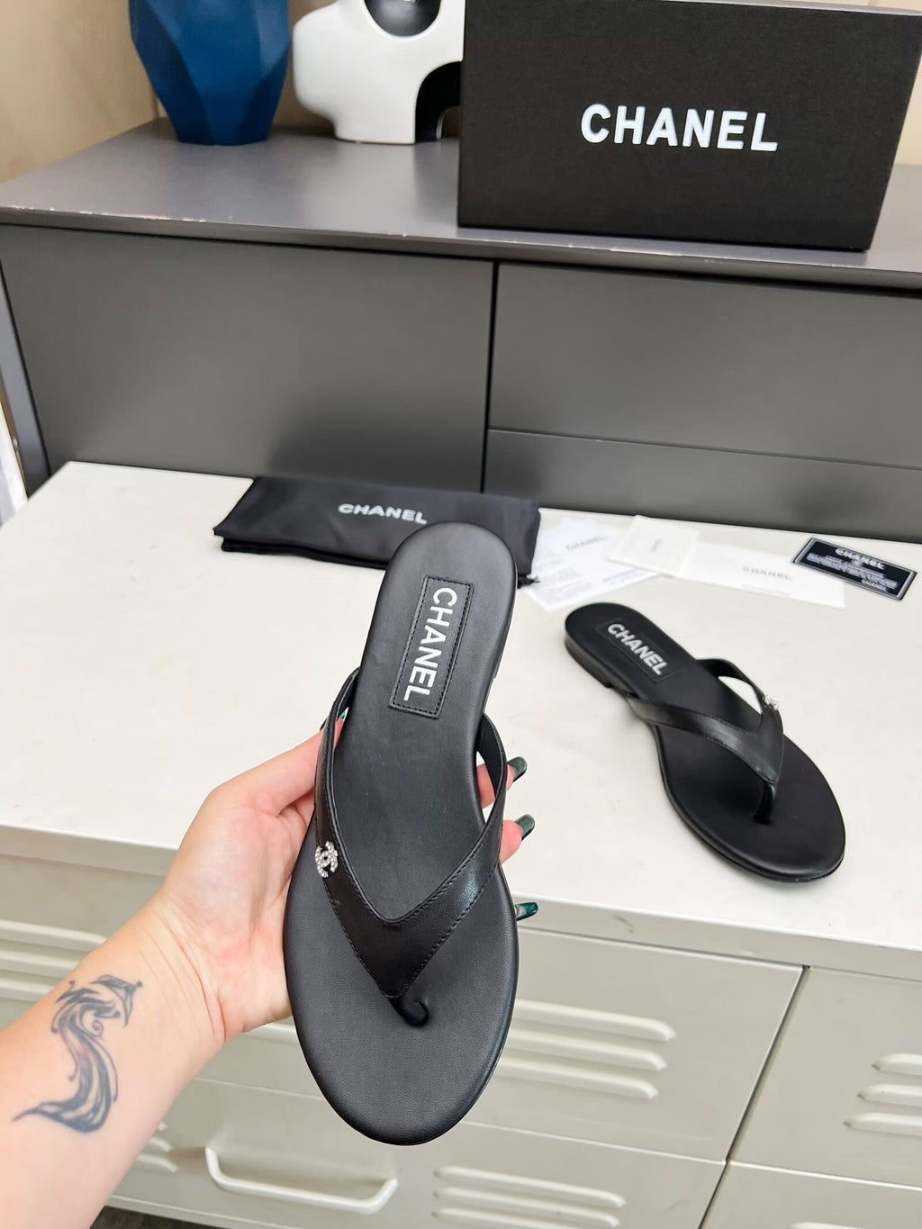 CHANEL THONG SLIPPERS IN BLACK COWHIDE