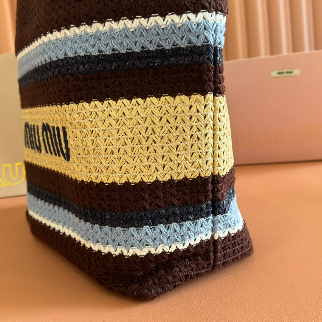 TOTE BAG 40 IN STRIPED PATTERN OF BROWN BLUE AND YELLOW WOVEN RAFFIA