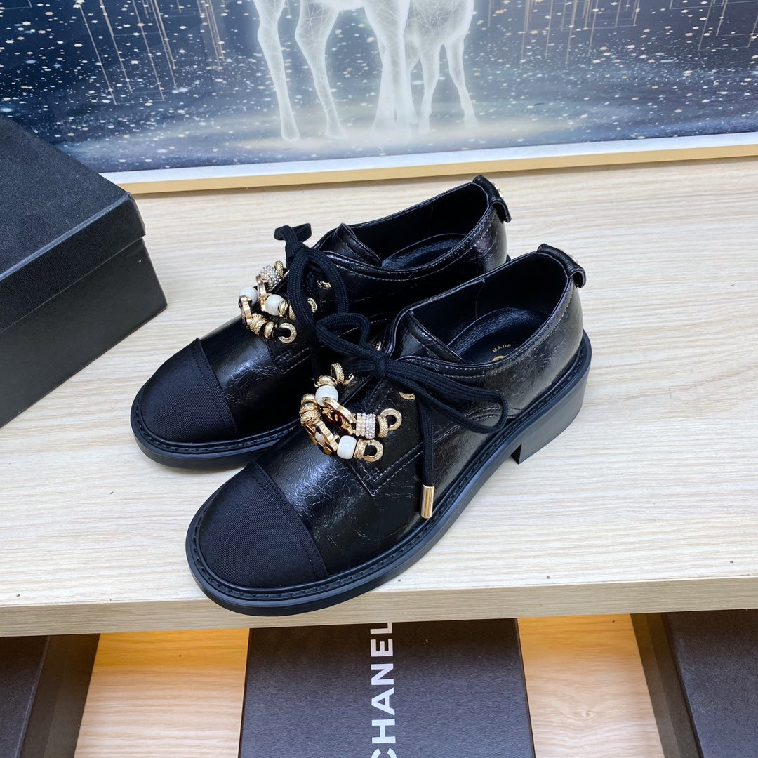 CHANEL COMBAT OXFORD SHOES IN BLACK WRINKLED CALFSKIN AND GROSGRAIN WITH FAUX PEARL