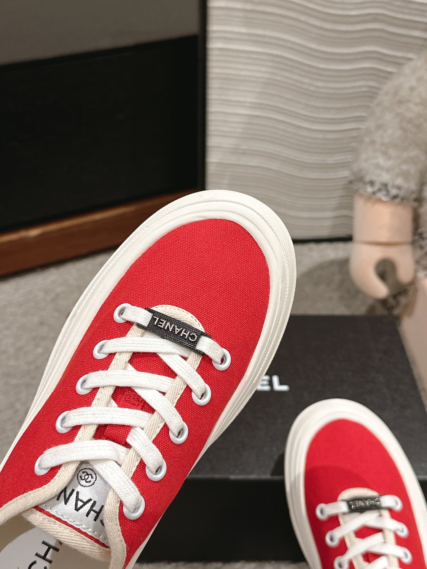 CHANEL LACE-UP SNEAKERS IN CHERRY RED CANVAS