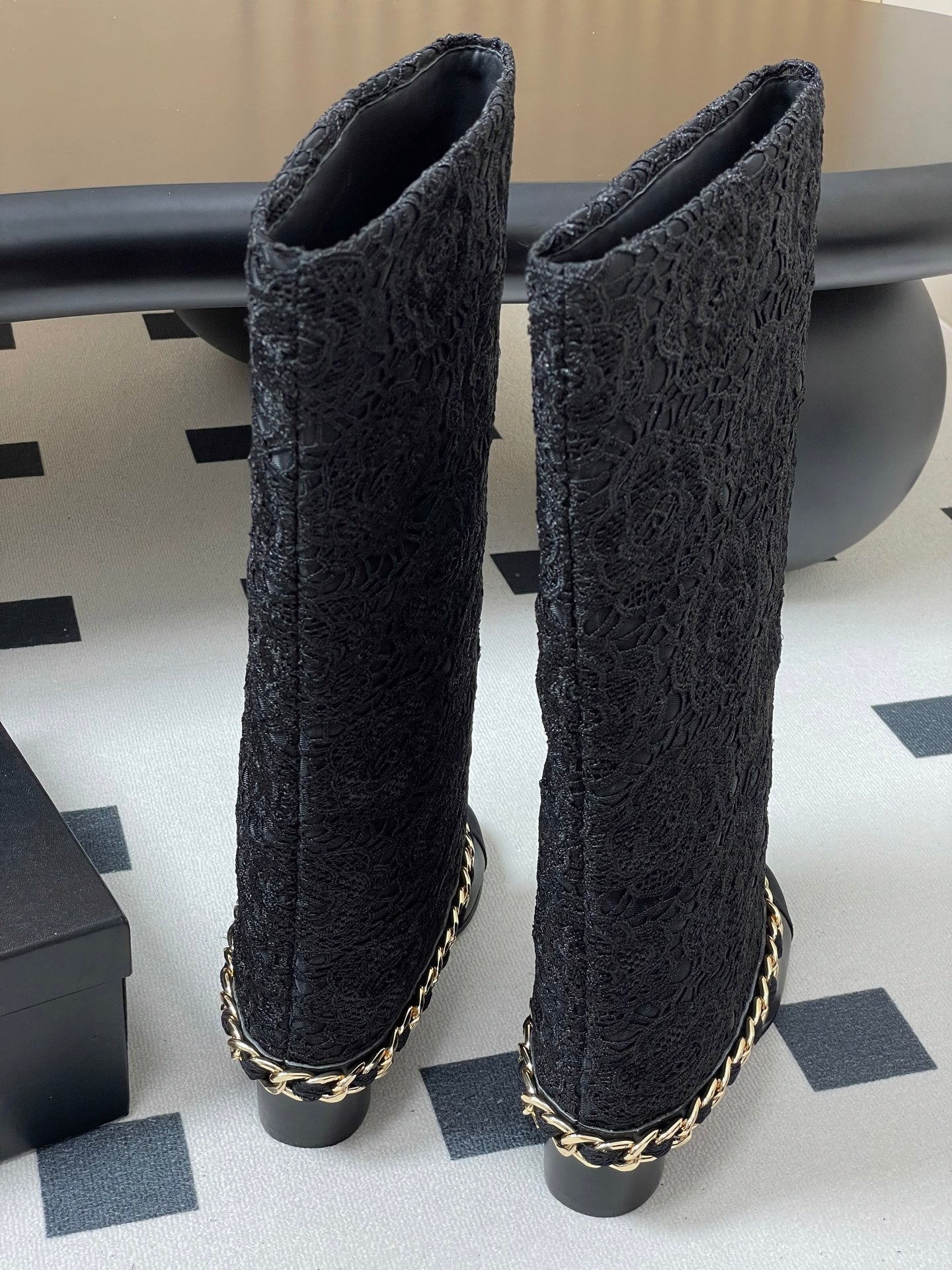 CHANEL FLORAL BOOTS 60MM IN BLACK CALFSKIN WITH GOLD CHAIN