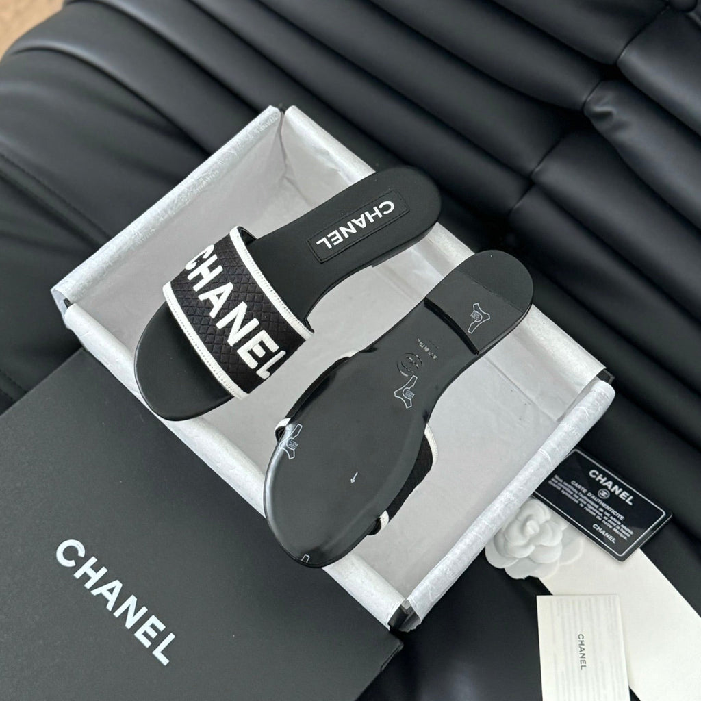 CHANEL Woven Embroidered Letter Slippers Black White
