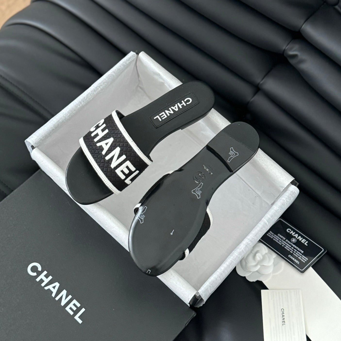 CHANEL Woven Embroidered Letter Slippers Black White
