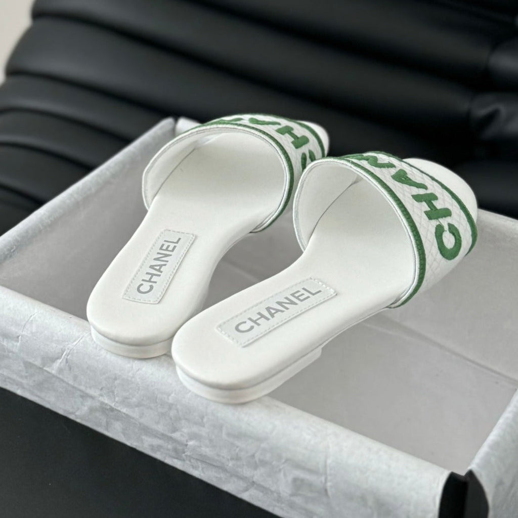 CHANEL Woven Embroidered Letter Slippers White Green