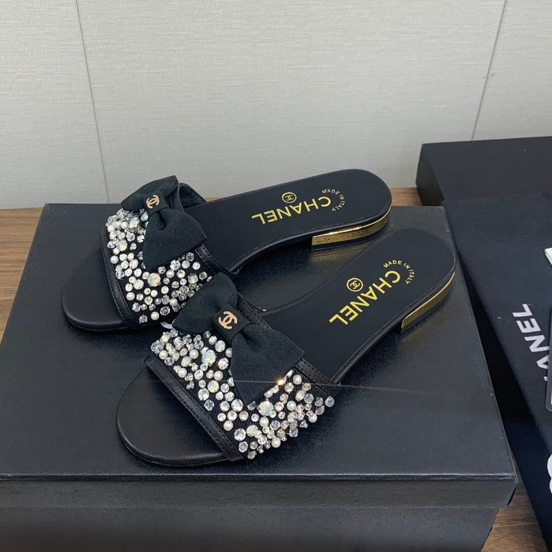 CHANEL BOW SLIPPERS IN BLACK LAMBSKIN WITH RHINESTONES