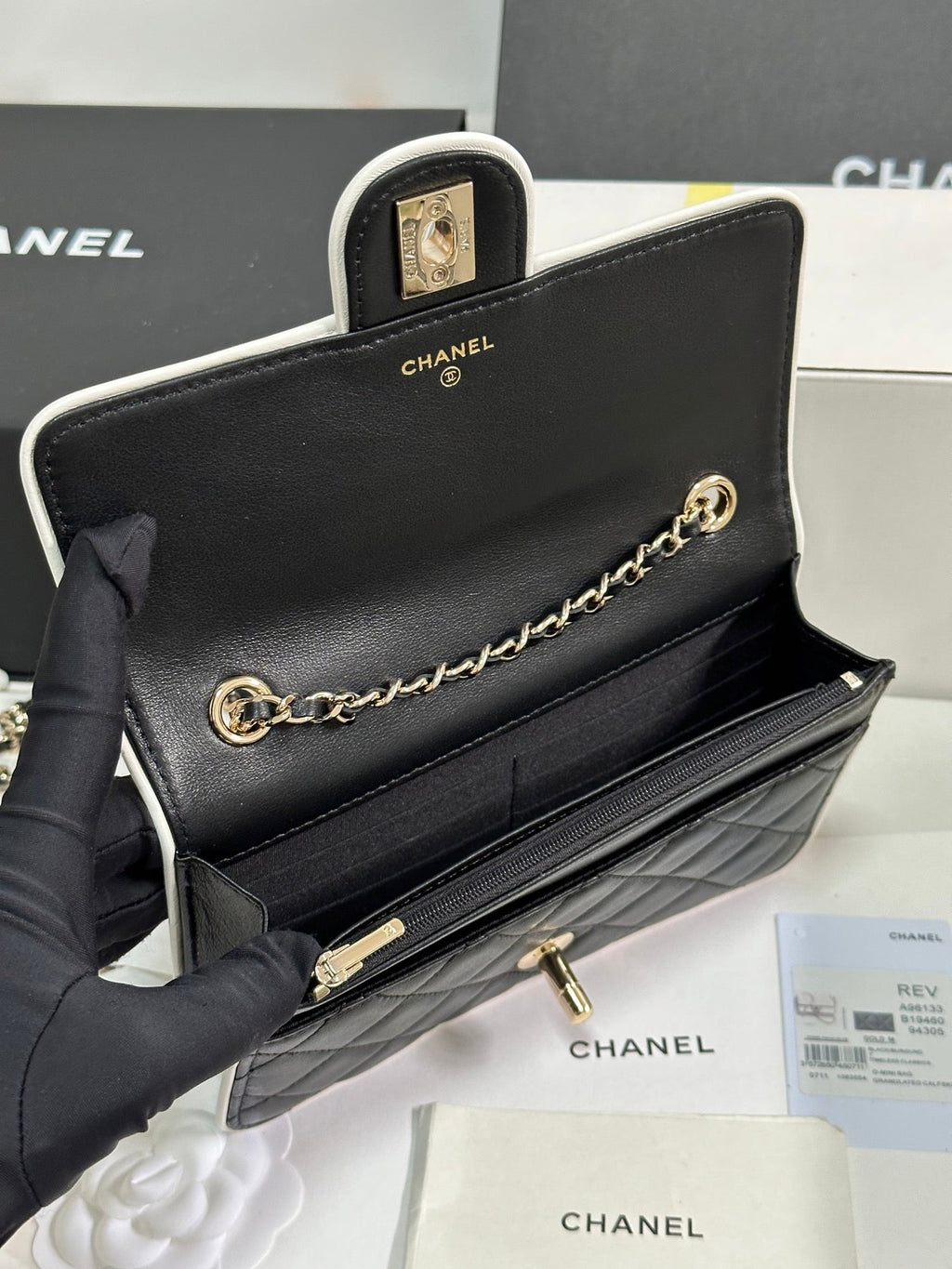 CHANEL QUILTED FLAP BAG WITH WHITE TRIM 19 IN BLACK LAMBSKIN
