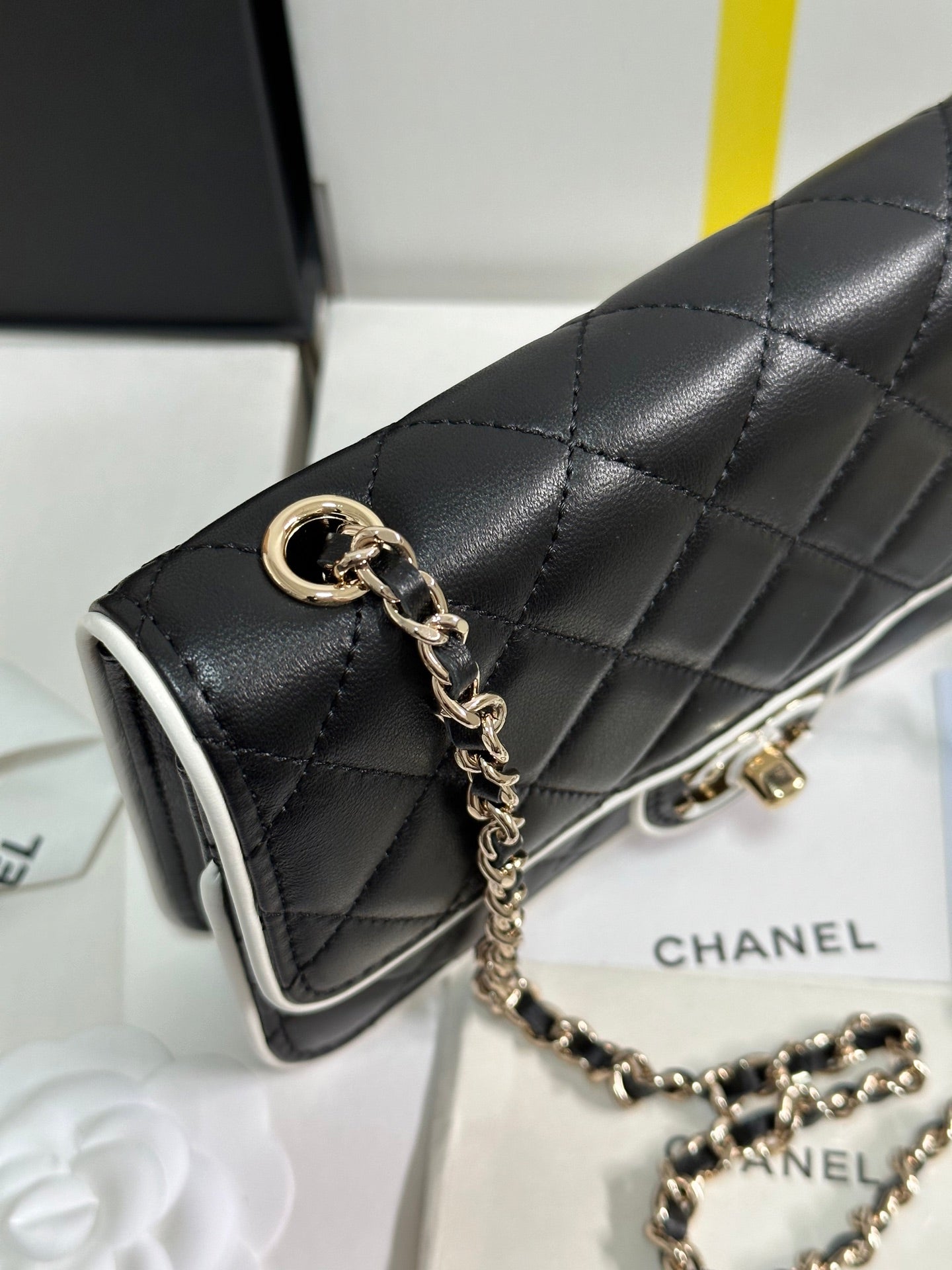 CHANEL QUILTED FLAP BAG WITH WHITE TRIM 19 IN BLACK LAMBSKIN