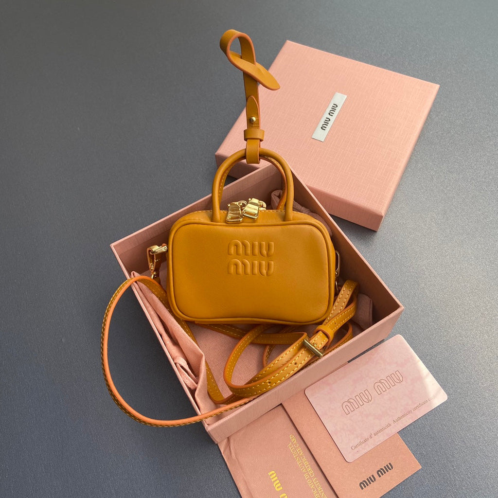 MICRO BAG KEYCHAIN 11 IN INDOCHINE ORANGE CALFSKIN EMBOSSED LOGO