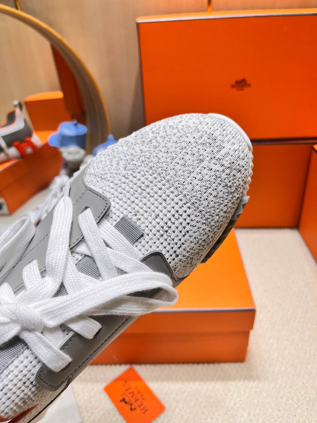 HERMES DEPART SLIP-ON SNEAKER IN WHITE MIX MOUSE GRAY KNIT AND CALFSKIN