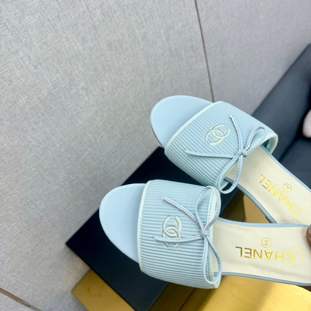 CHANEL BOW SLIPPERS IN LIGHT BLUE LAMBSKIN