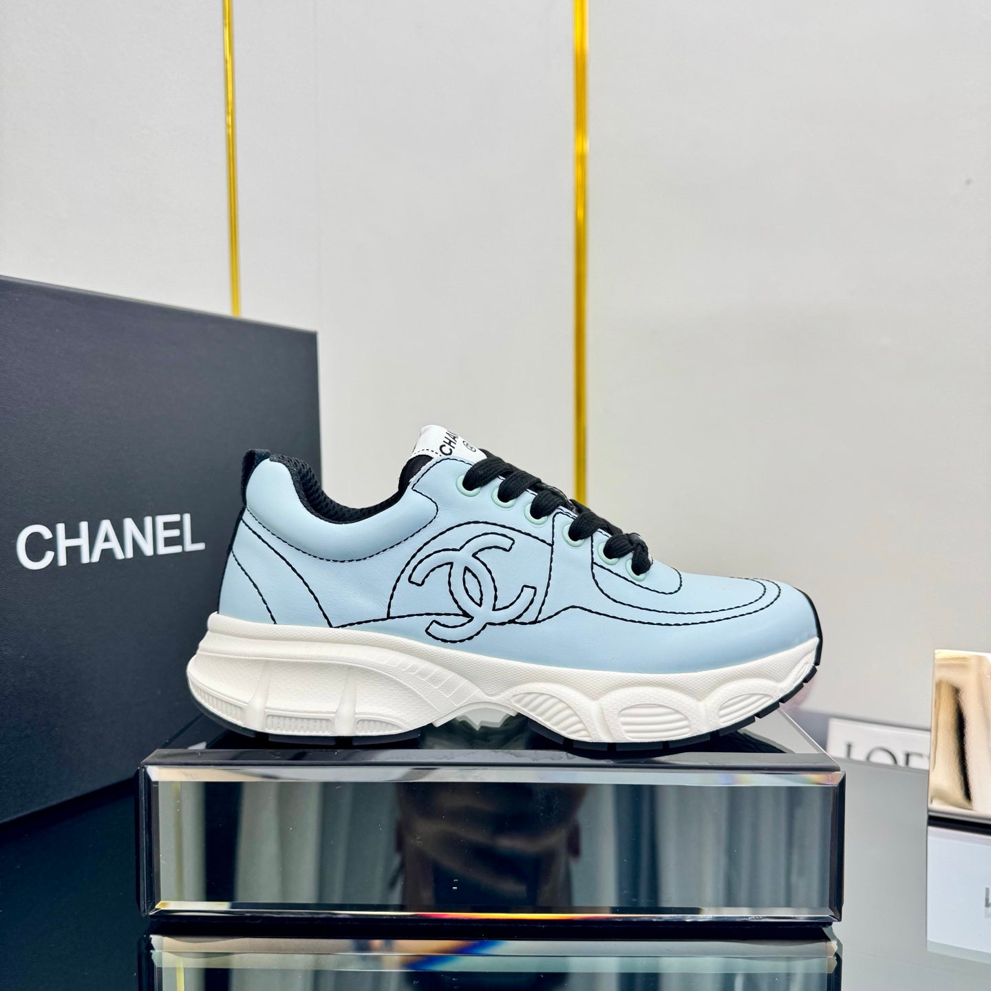 CHANEL TRAINERS SNEAKER IN LIGHT BLUE CALFSKIN WITH BLACK EMBROIDERED
