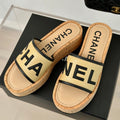 CHANEL THICK SOLE LETTER SLIPPERS IN DARK CREAM SHEEPSKIN